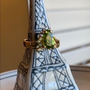 Gold ring with August birthstone and diamonds